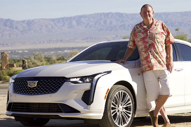 Rusty Austin standing next to his 2021 Cadillac CT4 