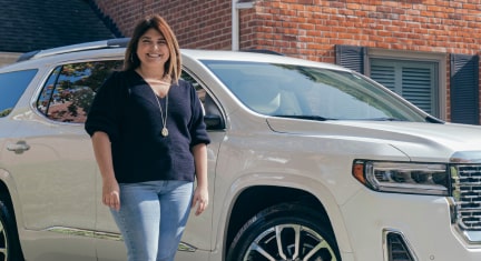 Ashlee McKinley Standing Next to Her GMC Vehicle 