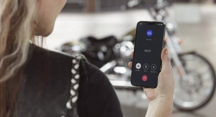 Female Motorcyclist Checking the OnStar Guardian App Location Feature