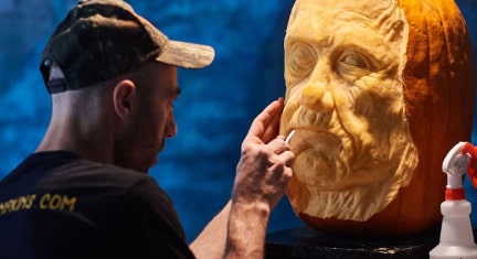 Man Carving Pumpkin in an Eerie Room