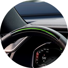 A closeup of the green light bar on the steering wheel.