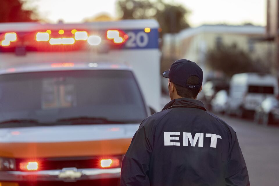 EMT Walks Towards The Ambulance's Drivers Side