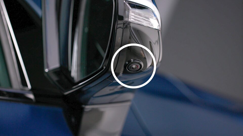 Close-up of the vehicle's passenger side mirror camera