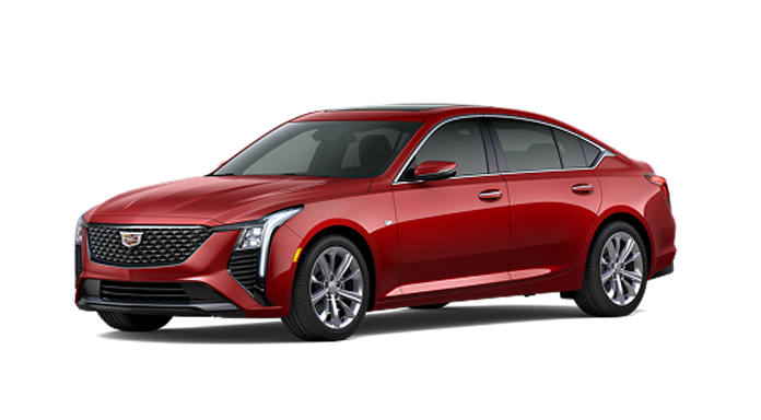 A red Cadillac CT5 luxury sedan, a connected vehicle that supports Super Cruise hands-free driving.