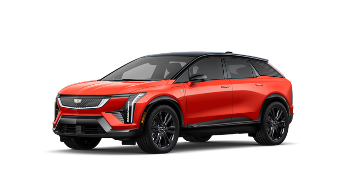 An orange Cadillac OPTIQ Premium Sport electric SUV, featuring driver assistance technology like Super Cruise.
