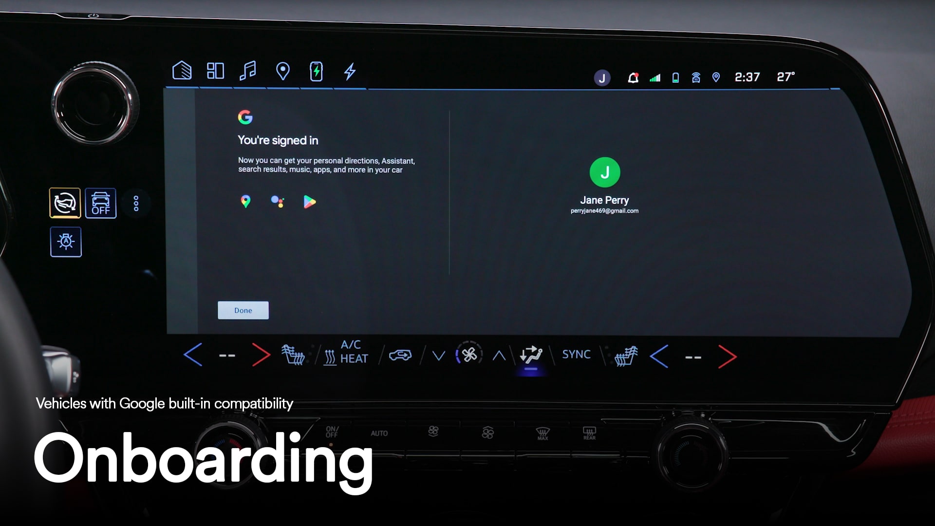 Close-up of the infotainment screen displaying a song playing with text overlay "Onboarding"