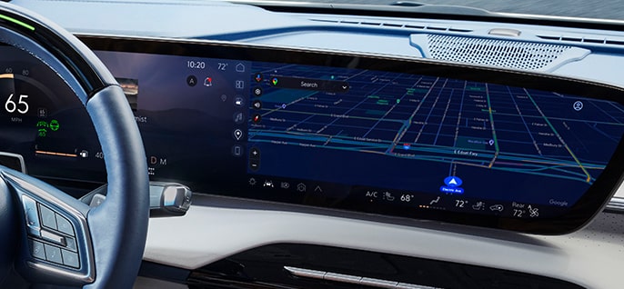 A driver's perspective shows a car's infotainment system displaying a detailed navigation map with a route.