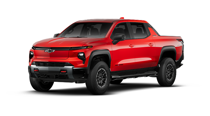 A red Chevrolet Silverado EV truck, an electric vehicle offering advanced driver assistance technology like Super Cruise.
