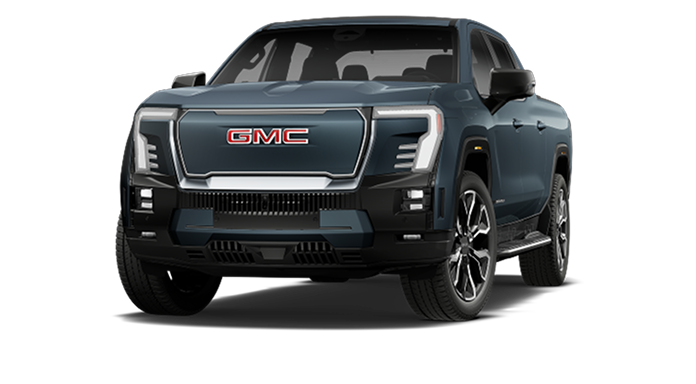 A dark blue GMC Sierra EV Denali truck, an electric vehicle offering advanced driver assistance with Super Cruise functionality.