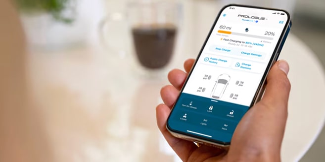 A woman using the HondaLink mobile app