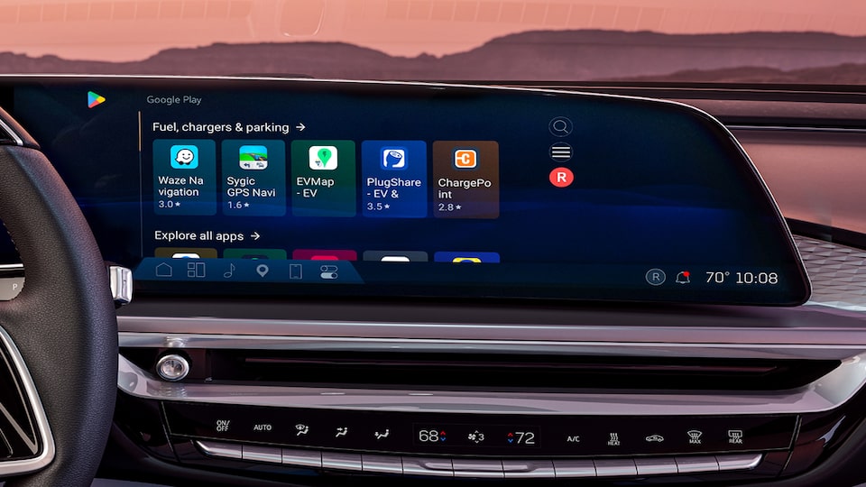 Infotainment System and Right Hand of Driver on Steering Wheel