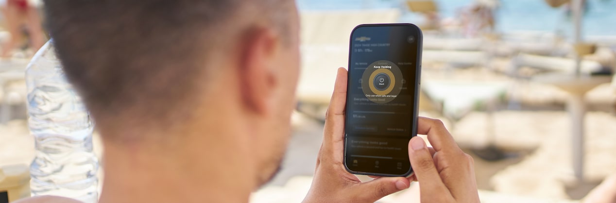  A woman pushing the start OnStar trial button