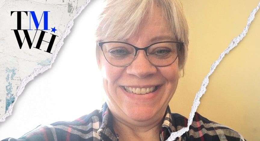 An older woman smiling while taking a selfie next to the text overlay of "Tell Me What Happened".