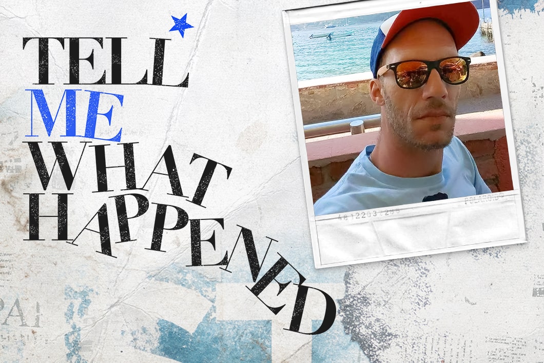 A man with hat wearing a sunglass on a bridge next to the text overlay of "Tell Me What Happened".