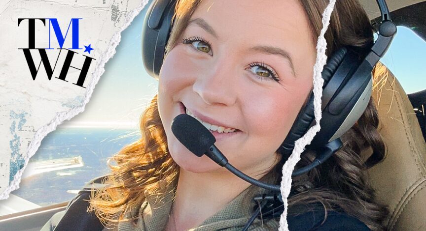 A woman taking a photo while piloting a plane on sunny day next to the text overlay of "Tell Me What Happened".  