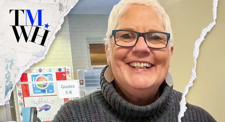 An elderly woman wearing turtleneck and glasses while smiling at the camera next to the text overlay of "Tell Me What Happened".  