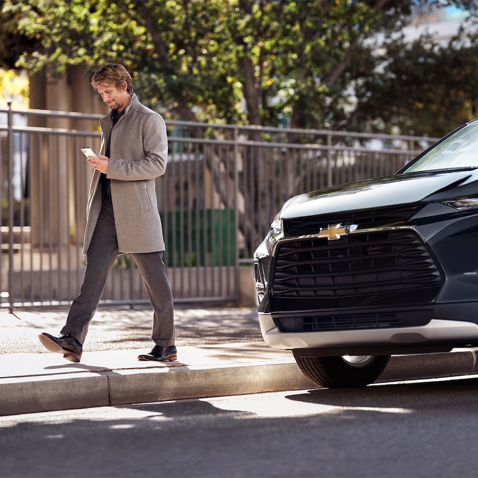 Man Using the OnStar Vehicle Location Map Feature
