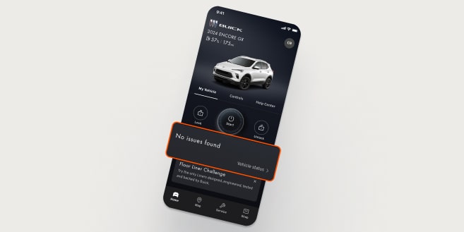 A smartphone displays the myCadillac app with a white SUV, featuring a "Roadside Sound" notification on a white surface.