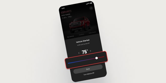 A smartphone displays the myGMC app, showing a red vehicle and a temperature slider set to 75 degrees for remote climate control.