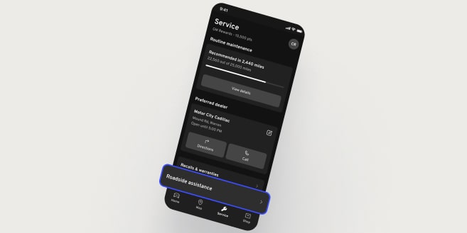 A smartphone displays the mobile app with a "Roadside Assistance" button highlighted at the bottom of the screen.