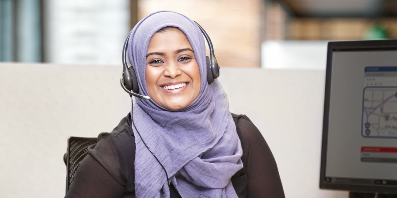 An OnStar advisor smiling ready to assist 
