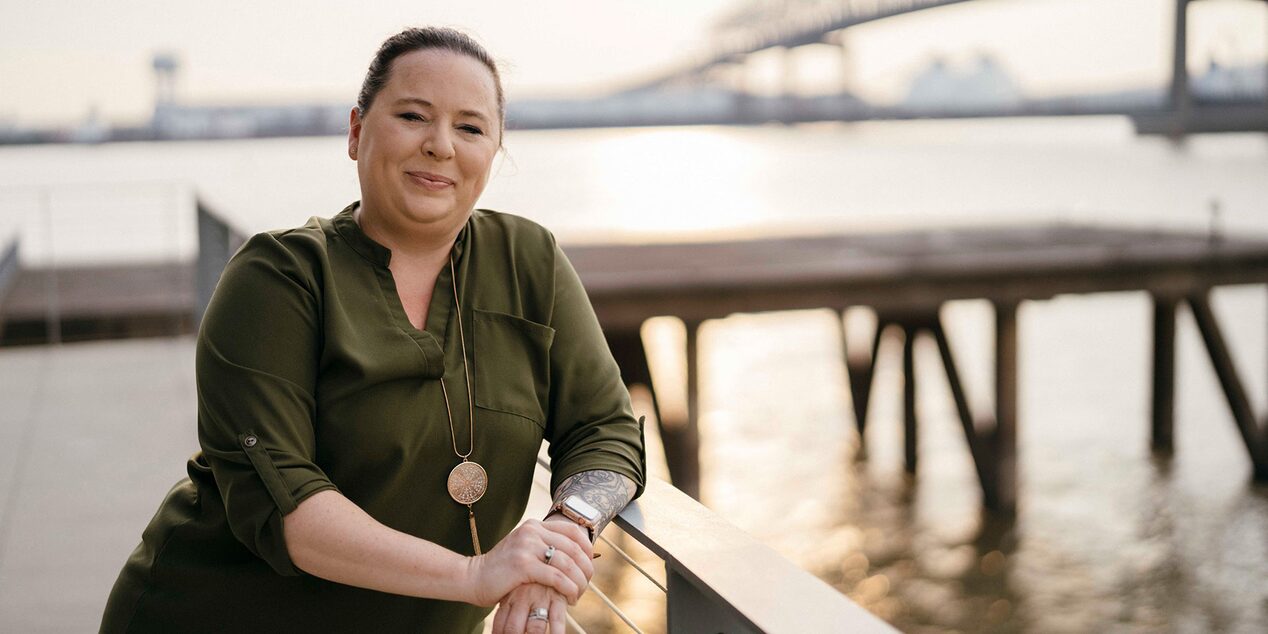 Women Standing on Pier Smiling