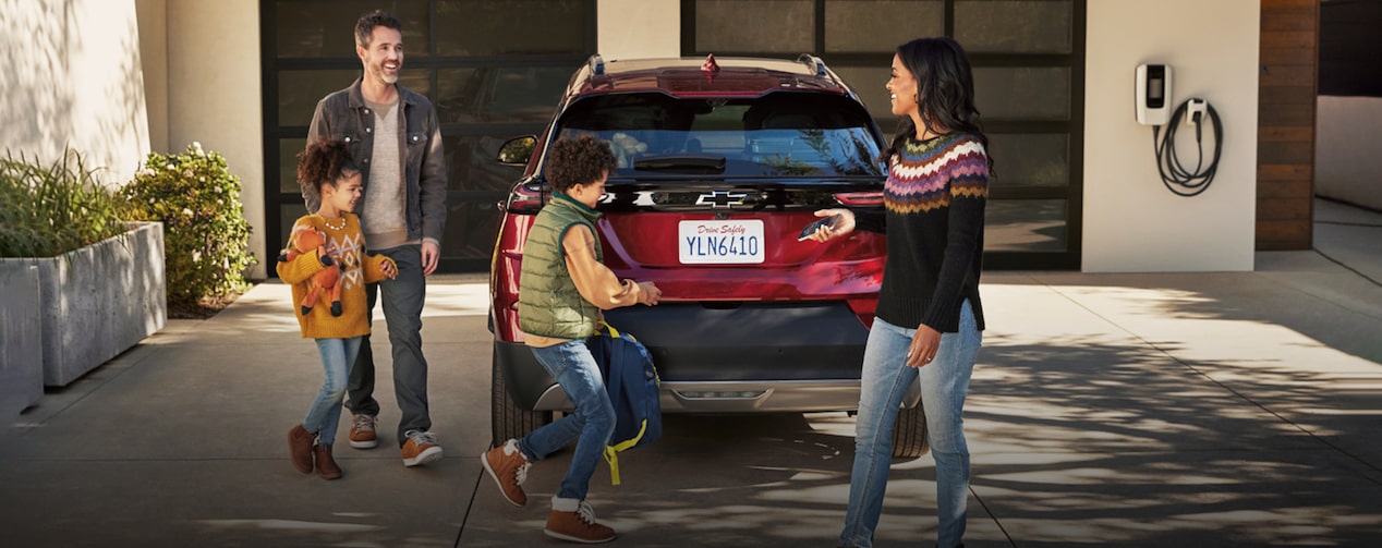 Family Loading the Back of their Vehicle for a Road Trip