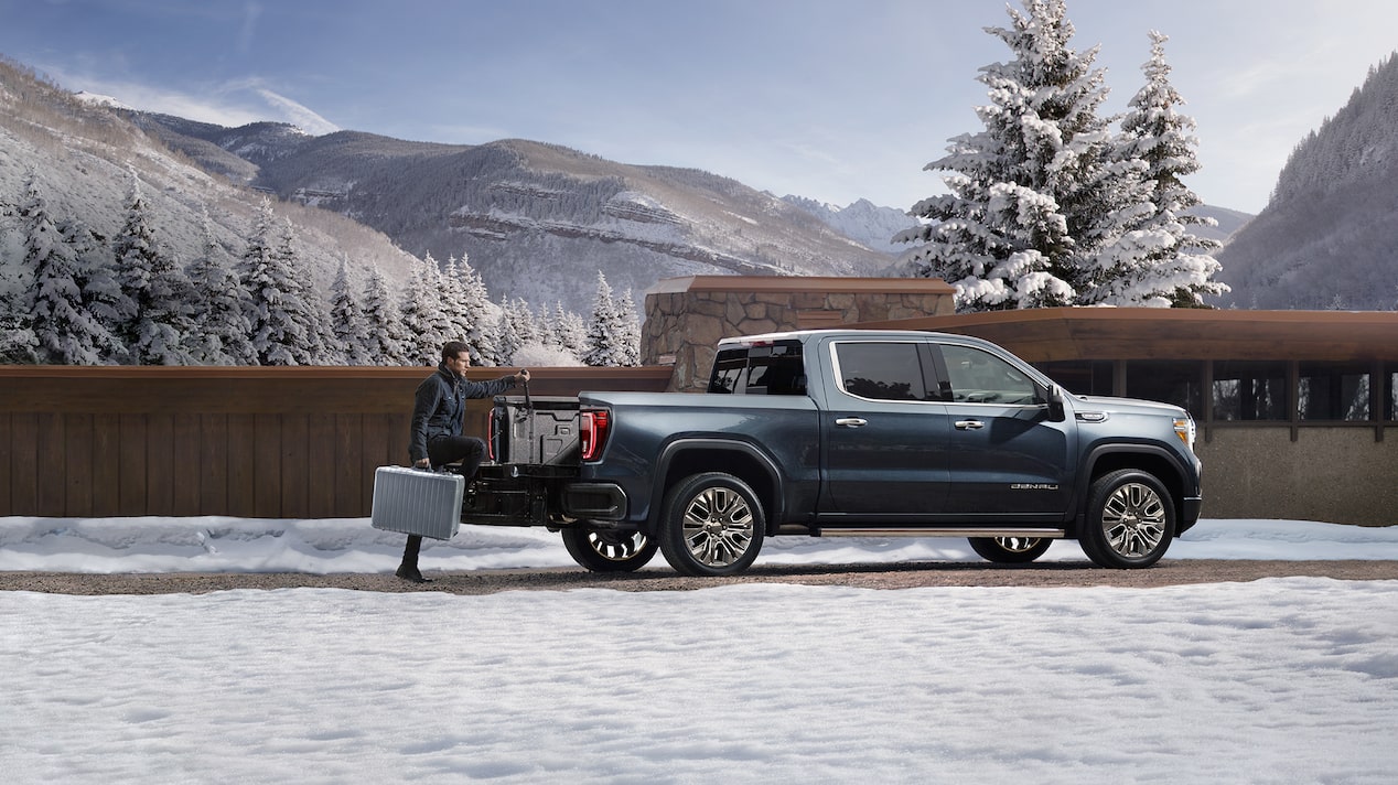 A Man Loading the Tailgate of His Truck