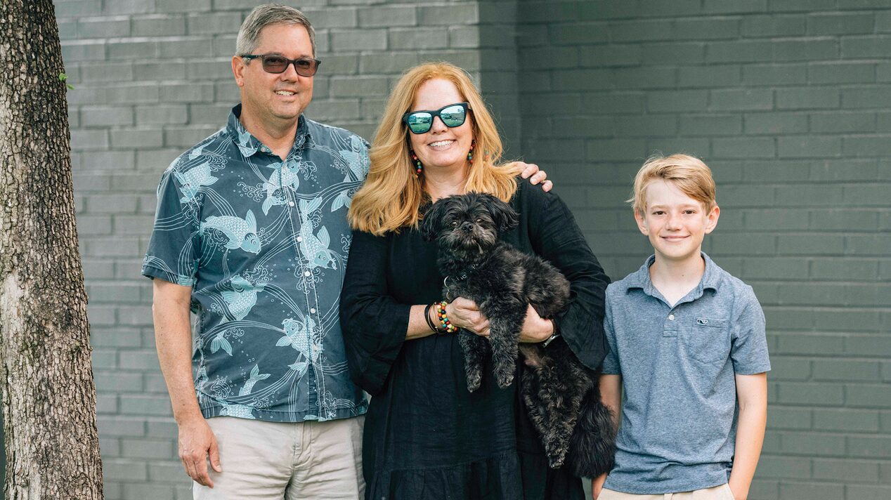 Family and Dog Smiling Standing Together