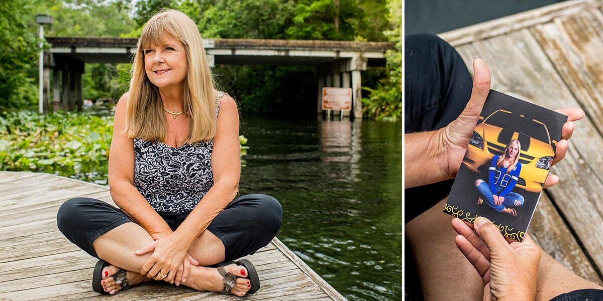 Mother Sitting on a Dock Looking at a Family Photo