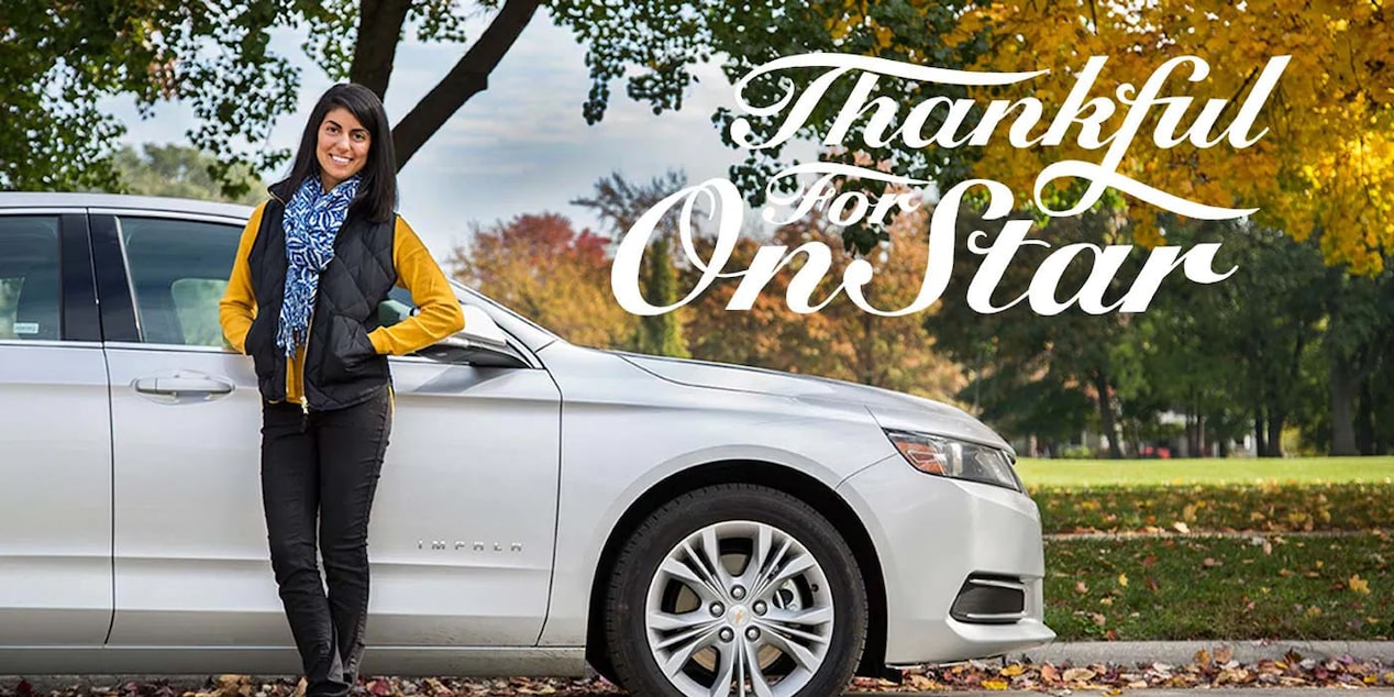 Woman Standing Next to GM Vehicle - Thankful for OnStar