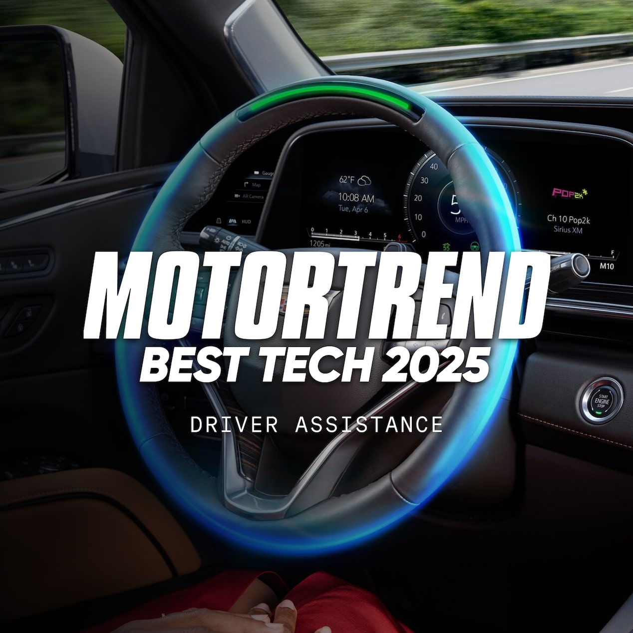 Steering wheel in a vehicle with a text overlay stating "Motortrend Best Tech 2025 Driver Assistance"