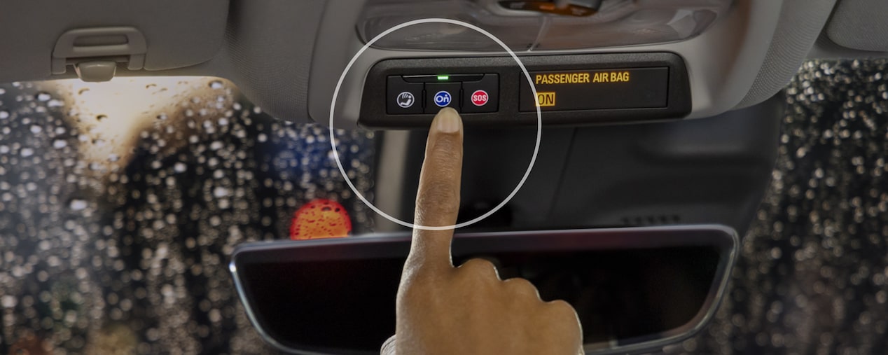 Close up View of Customer Pressing the OnStar Button