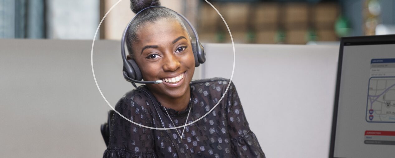 Female OnStar Advisor Smiling with Headset on