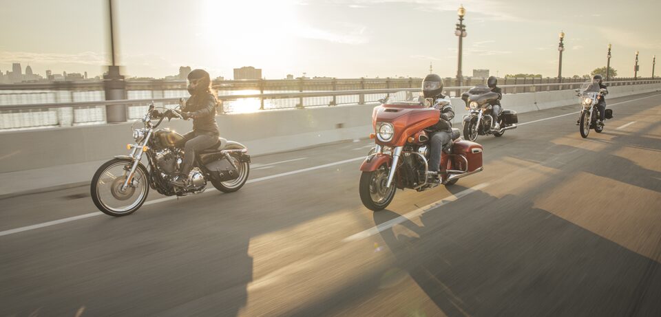 Four Motorcycle Drivers Riding Across the Belle Isle Bridge