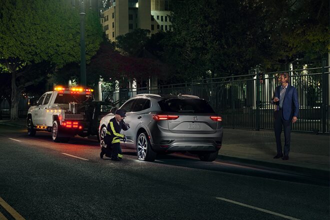 Roadside Assistance Changing a Tire at Night time