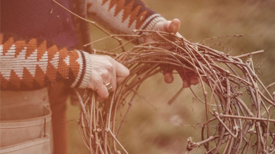Woman Making a Wreath Out of Spare Sticks