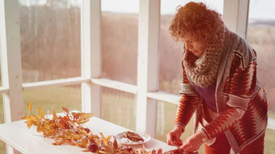 Woman Using Foraged Items to Make Fall Decor