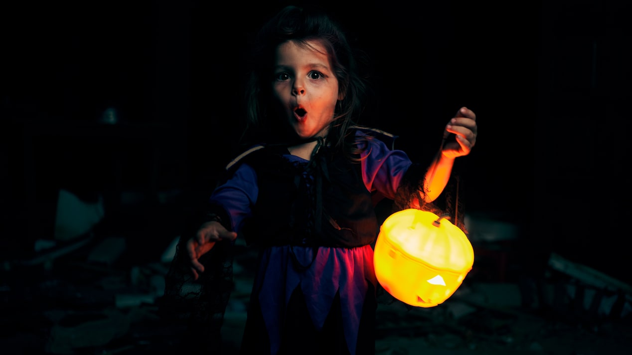 Little Girl Looking Surprised Outside in the Dark