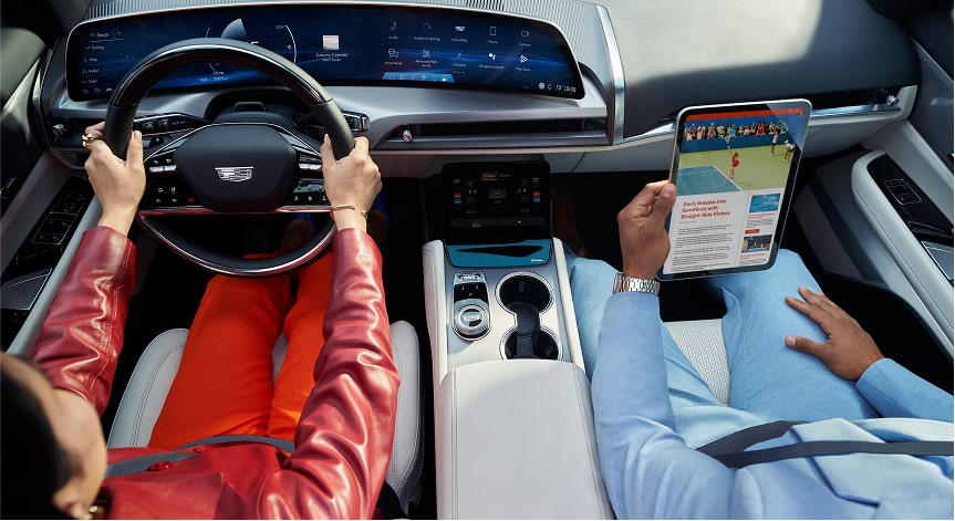 Woman reaching to touch her vehicle screen