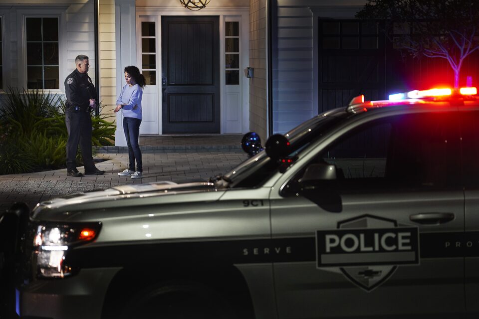 Officer Talks to Victim In Front of House and Patrol Car
