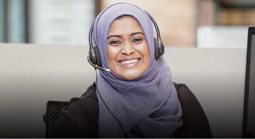 Female OnStar Advisor Smiling at the Camera