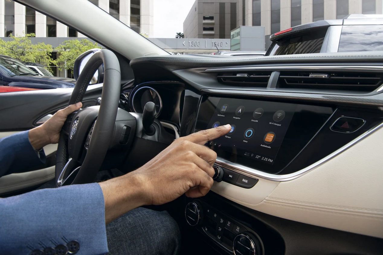 Driver Pressing Button on Infotainment System